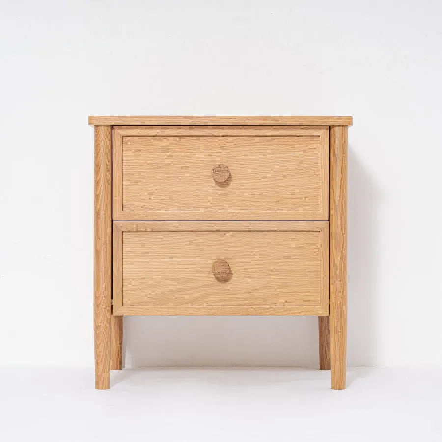 Wooden nightstand with two drawers on a white background
