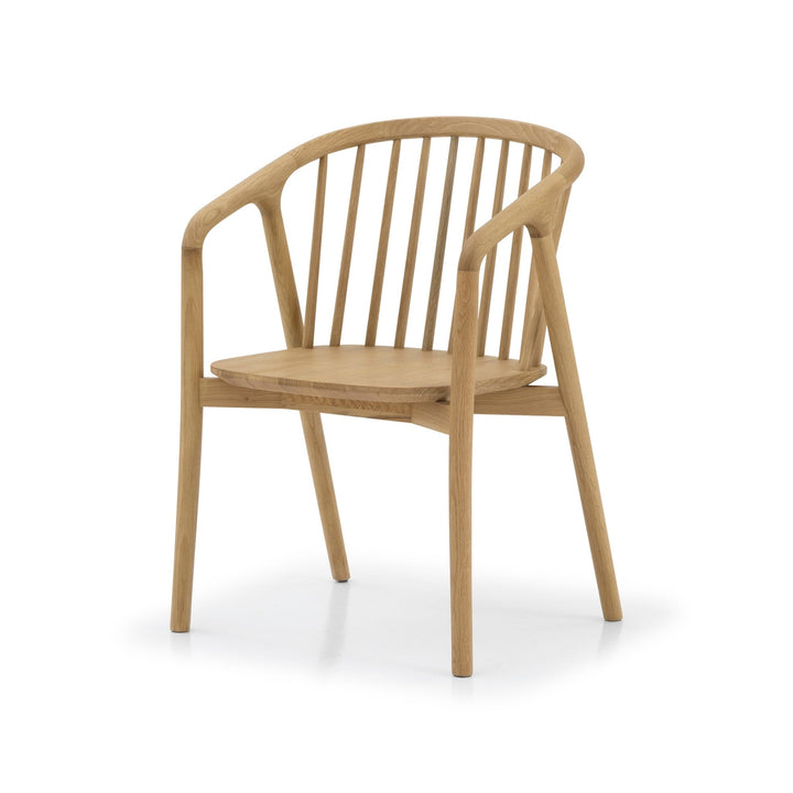 Saga American White Oak Dining Chair - spindle backrest, curved armrests, and natural matte lacquer finish, angled view