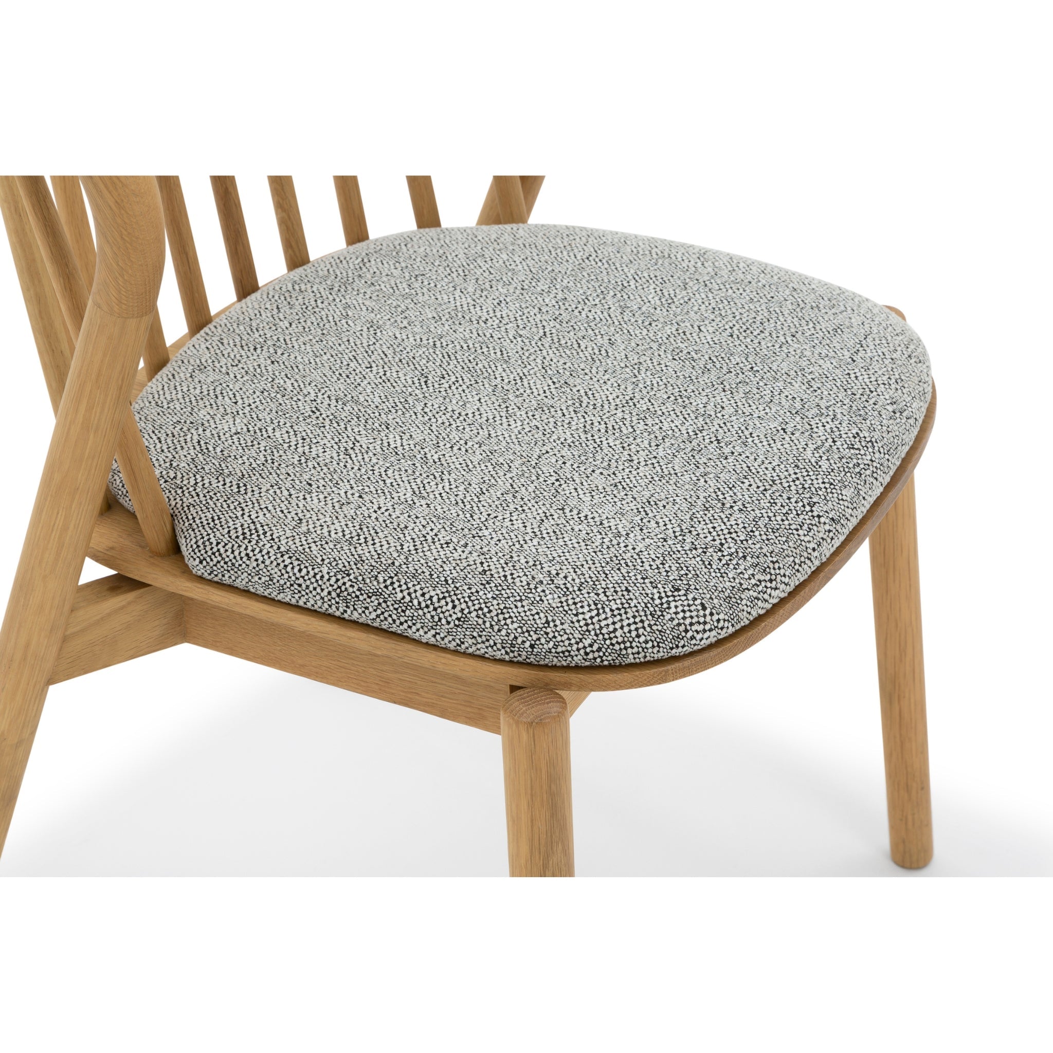 Saga - Classic Oak Dining Chair with Noel Seat Pad in solid natural oak wood with textured grey fabric cushion, close-up view, gallery position 1
