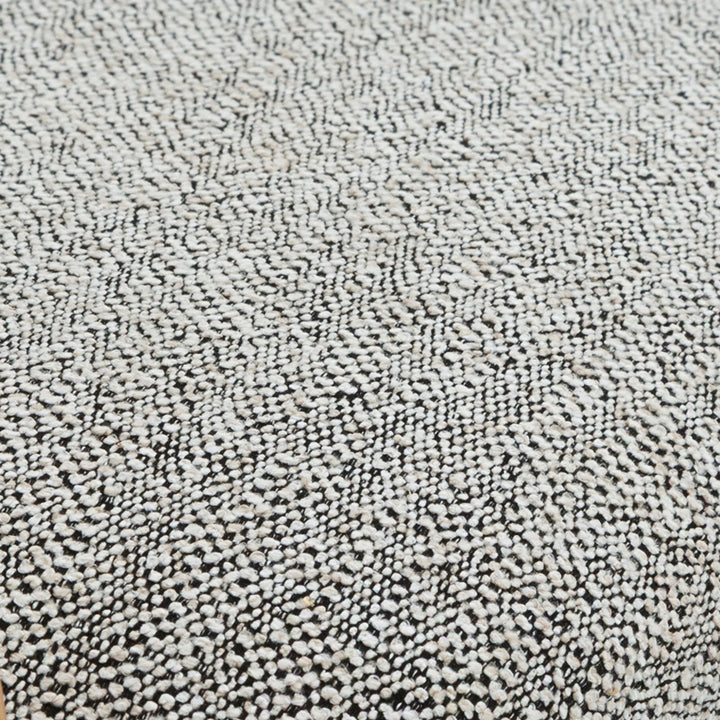 Saga Noel seat pad top-down close-up, black and white woven fabric texture detail