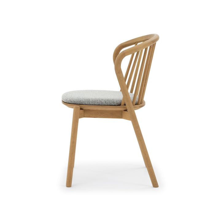 Saga American White Oak dining chair with Noel seat pad, curved spindle backrest, side view