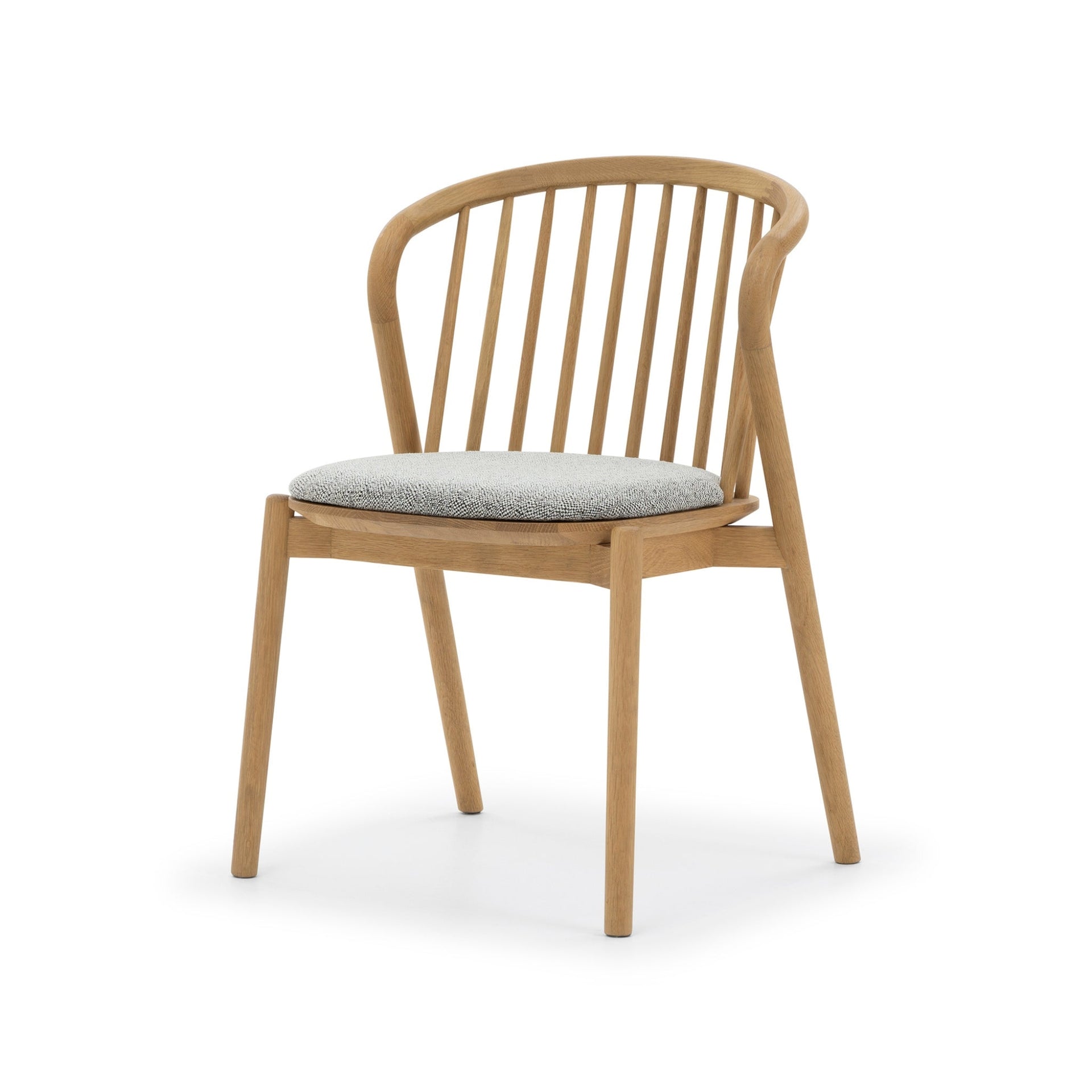 Saga American White Oak dining chair with Noel seat pad, spindle backrest, angled front view