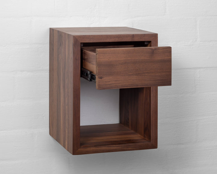 Hugo Walnut Floating Nightstand angled view on white background with drawer partially open revealing  soft-close metal rails