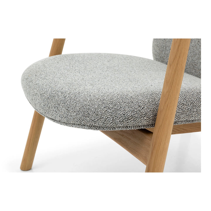 Theo Armchair – Noel Fabric close-up of rounded seat cushion and solid natural oak frame