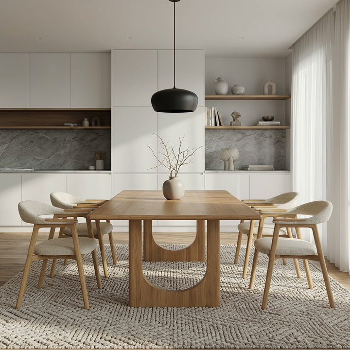 Theo oak dining table with cream upholstered chairs in a modern kitchen