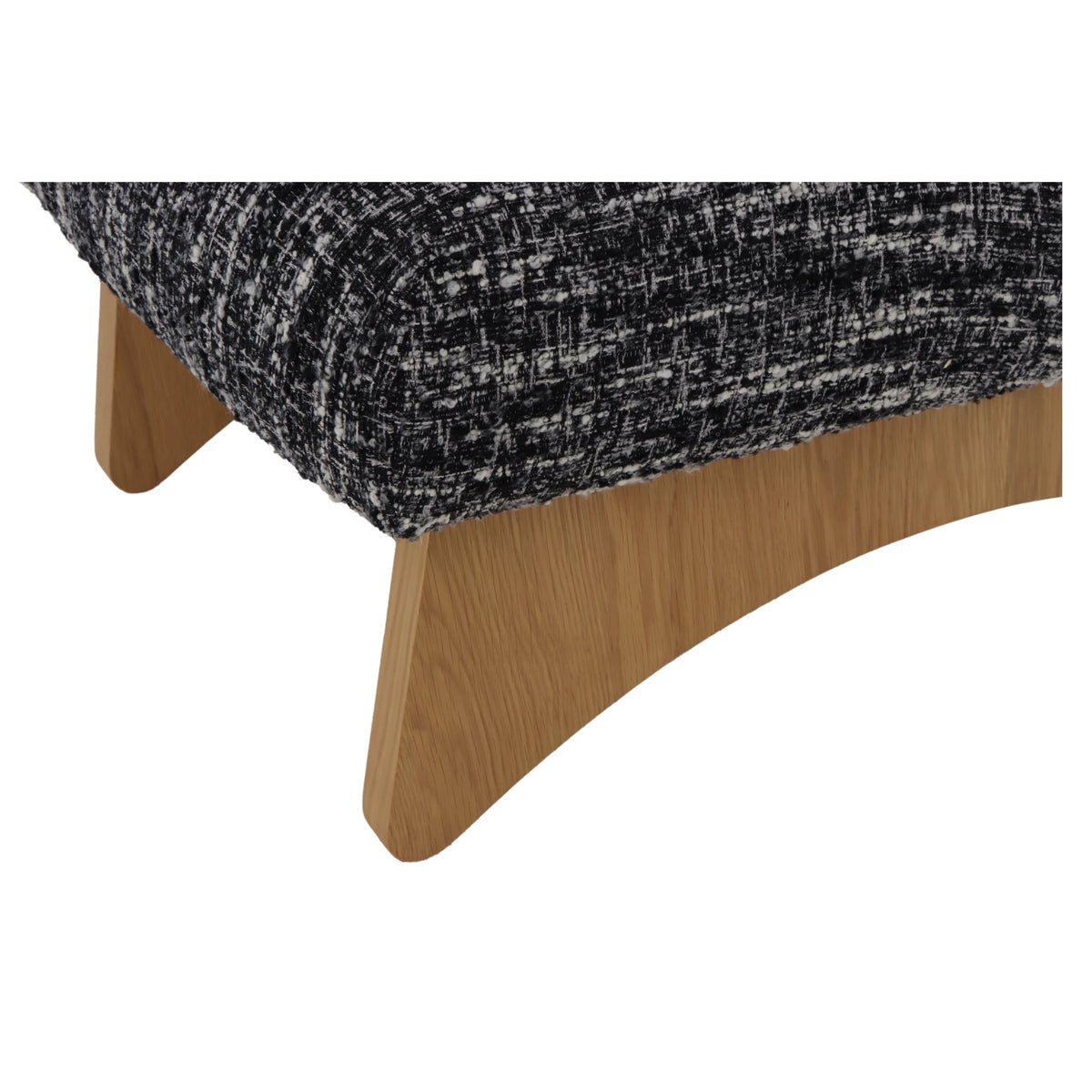 Tommy – Black Fabric Armchair with Oak Legs close-up on the curved solid natural oak base and black-and-white textured fabric edge