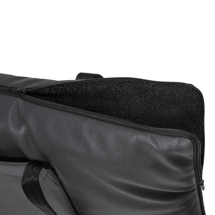 Portable pet travel bag that converts into a mattress, black fabric with treat pocket